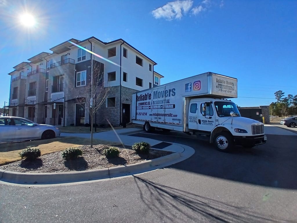 Reliable Movers crew loading a moving truck in Fuquay‑Varina, NC